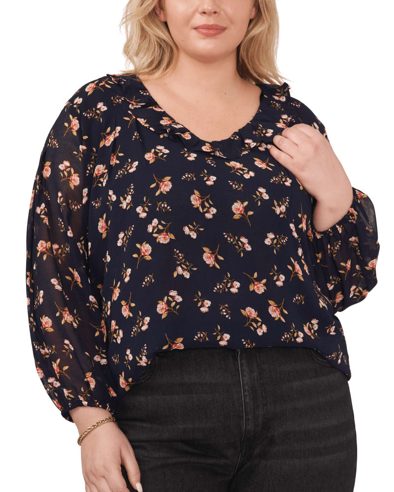 Front of a model wearing a size 0X Charlotte Ruffle V-Neck Top in FLRL TWLGHT BLU by 1.State. | dia_product_style_image_id:262163